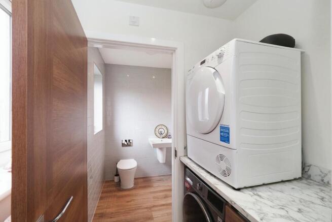  Out of the way  laundry space and large downstairs toilet