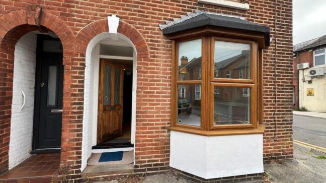 Charming red brick exterior with bay window...