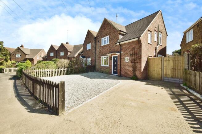 Outside View Of The Property With Driveway Parking