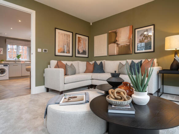 Stamford lounge with L shaped sofa and access into the kitchen dining area