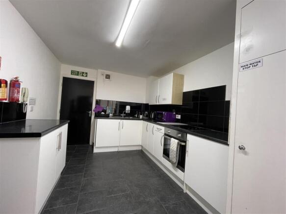 Bright kitchen with modern white cabinetry...