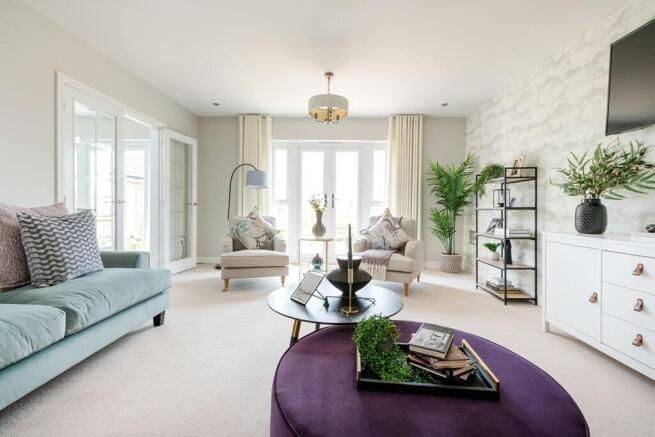 The living room features double doors out to the rear garden