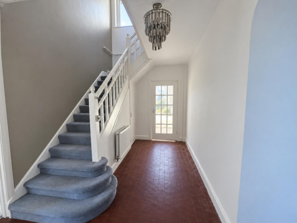 Bright Greige Hallway with Staircase - 3 Richmond