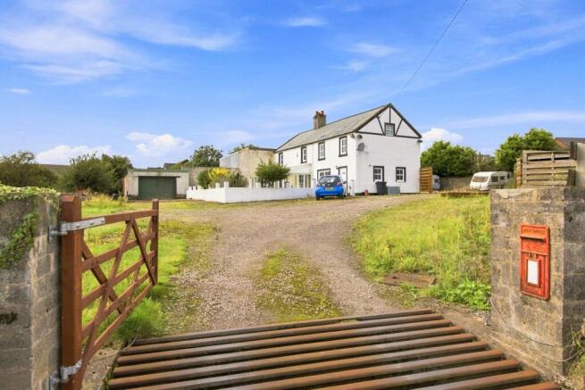 Entrance Gate show Existing House and Garage