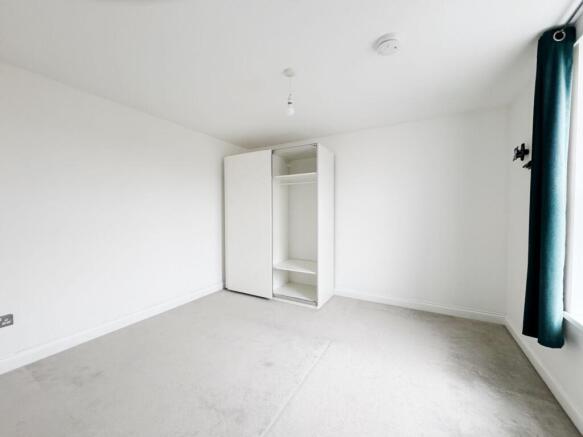 Bright, neutral double bedroom with clean carpe...