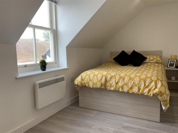 Bright attic double bedroom with smart storage ...