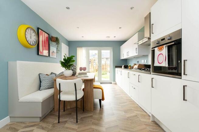 The kitchen/dining area boasts double doors out to the garden