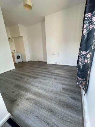 Bright room with new grey wood-effect flooring...