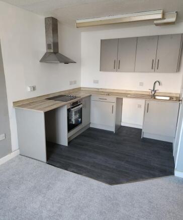 Modern kitchen with sleek grey cabinets...