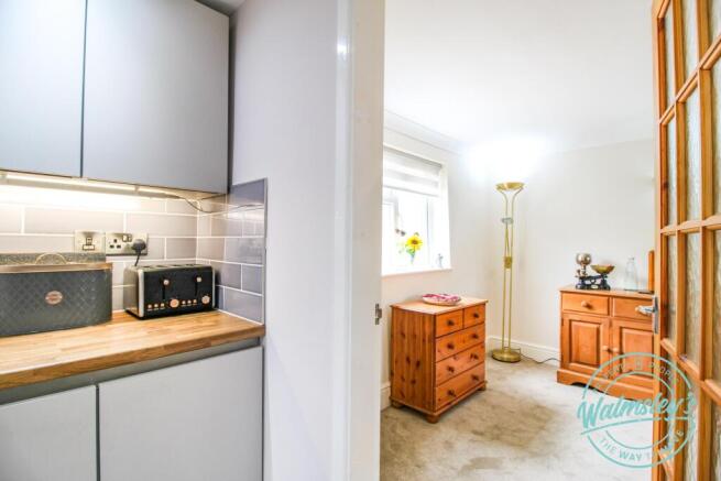 Kitchen leading towards sitting dining room