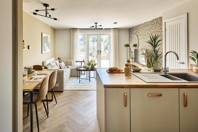 The peninsula island separates kitchen and living areas seamlessly