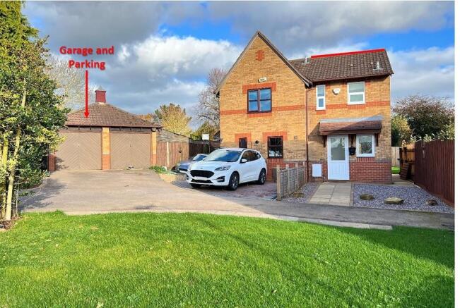 Left hand garage & parking and right hand house an