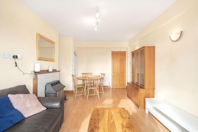 Spacious living room with natural light...