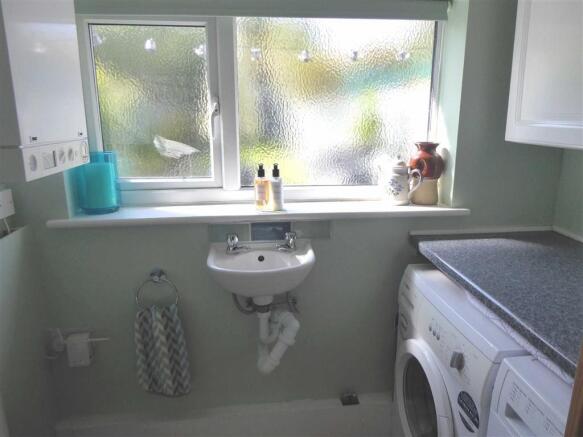 CLOAKROOM/UTILITY ROOM