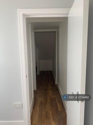 Entrance To Kitchen And Back Bedroom And Bathroom