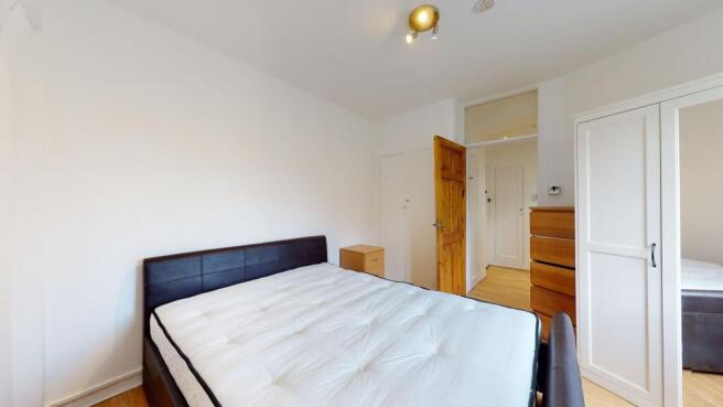 Bright double bedroom with ample storage space...