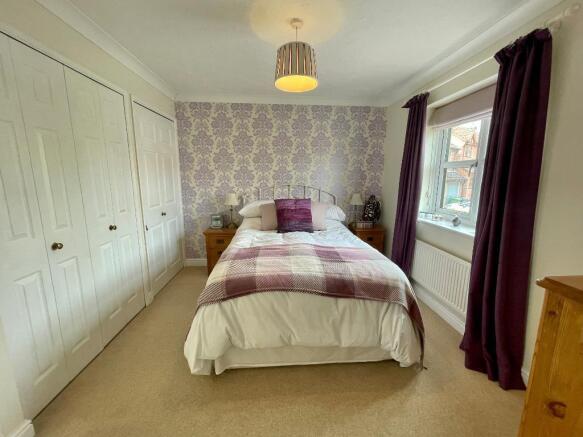 Main bedroom with fitted wardrobes