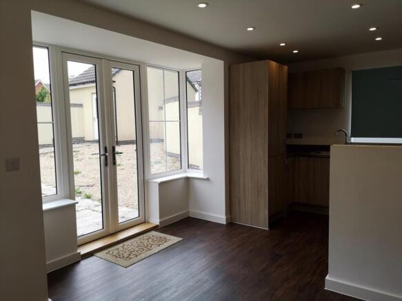 A modern and well-lit kitchen with ample space ...