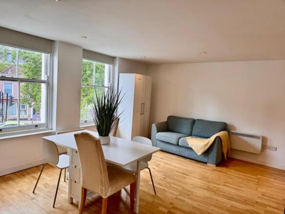 Bright, open living area with modern furnishing...