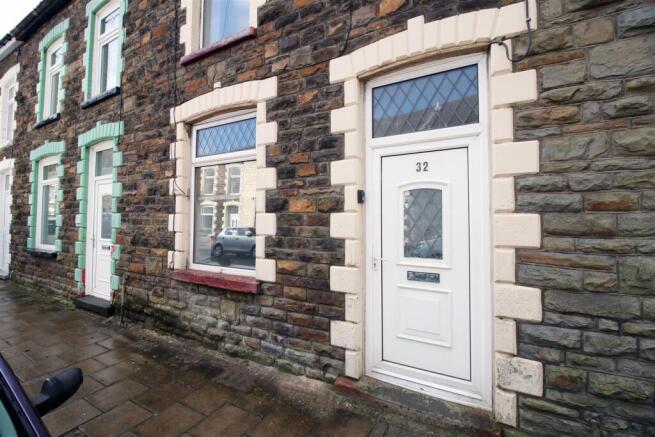 Charming stone-fronted terraced home exterior...
