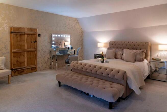 The Principal suite with attached copper ensuite and dressing room