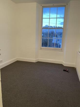 Bright, freshly decorated single bedroom with a...
