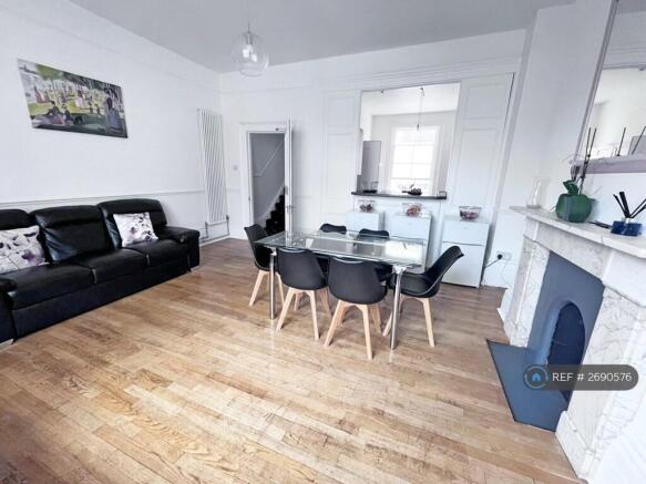 Living Room: Dining Seating For 8, 2 Large Sofas