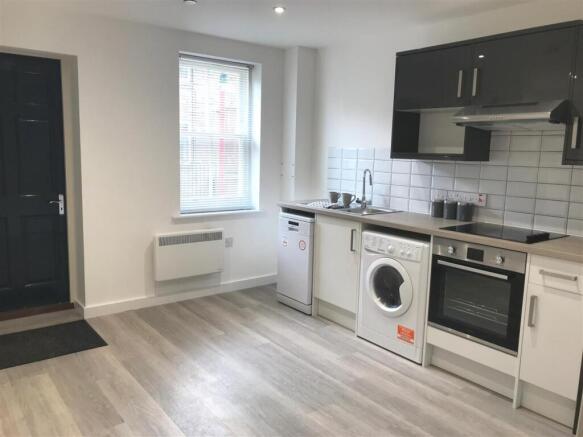 Modern fitted kitchen with sleek appliances...