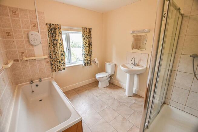 12 The Village - bathroom (brochure).jpg
