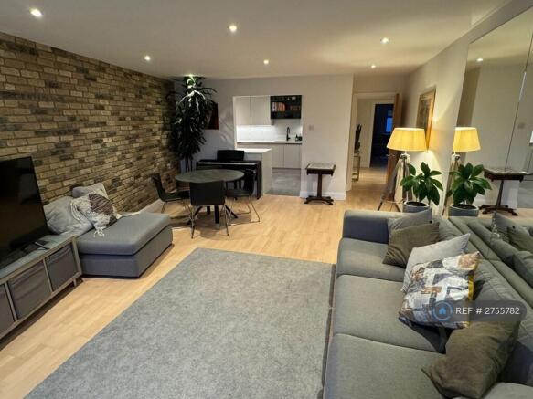 Living Room And Entry To The Kitchen