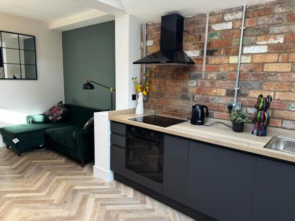 Modern kitchen with chic exposed brick walls...