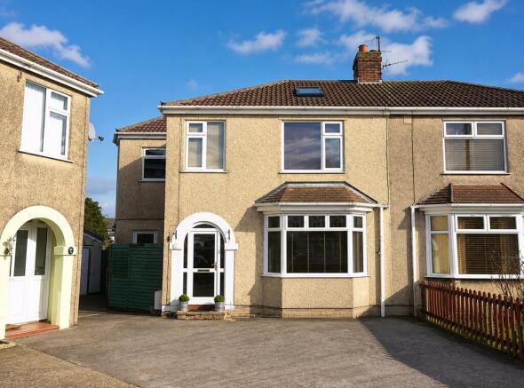 Charming house exterior with spacious driveway...