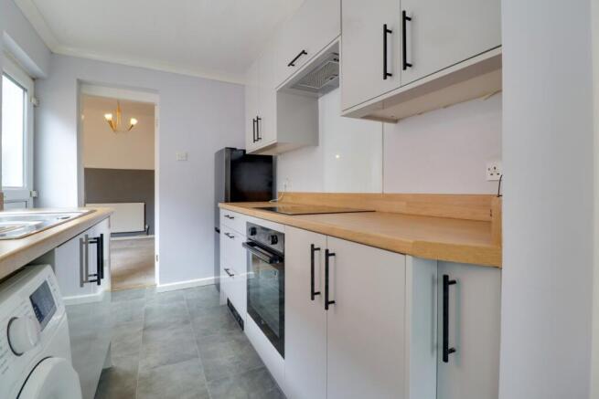 view from shower room showing induction hob and un