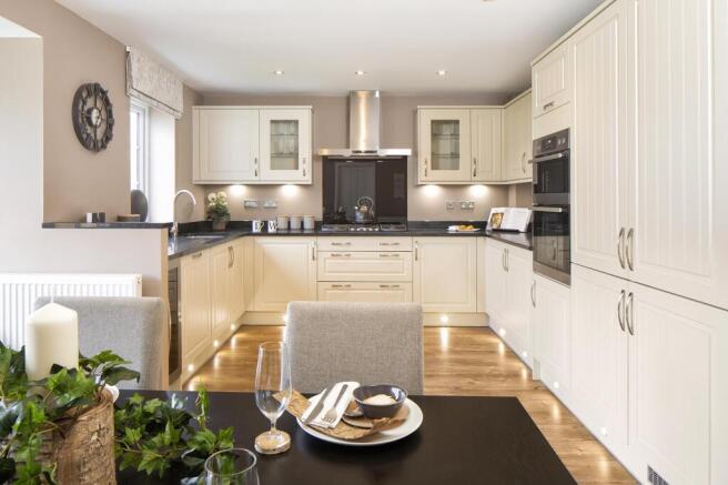 Open-plan kitchen with family and dining areas