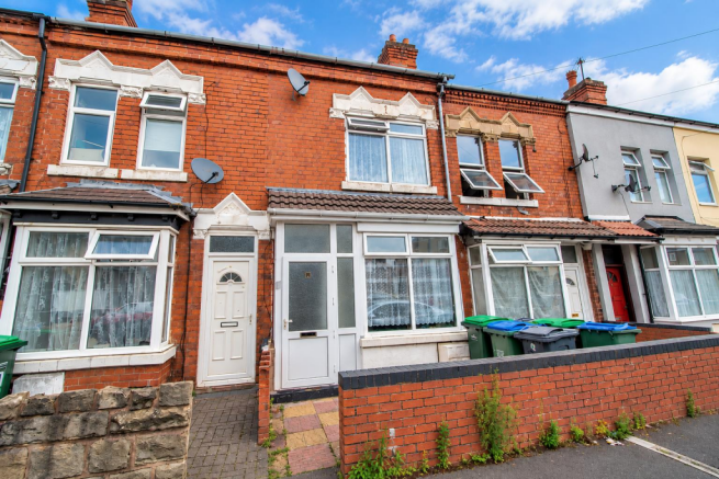Victorian Terraces Under a Cloudy Sky.png