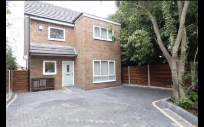 Modern detached home with large paved driveway...