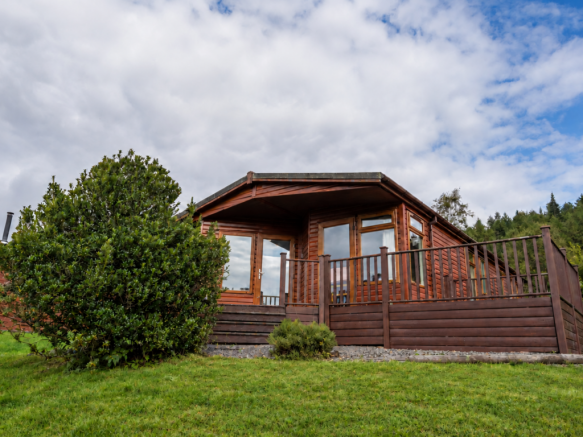 Exterior of the three-bedroom holiday lodge with r