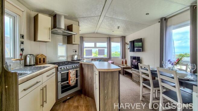 Open plan kitchen dining and living area in the De