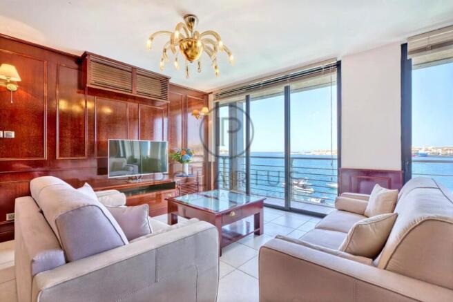 Spacious living room with floor-to-ceiling windows