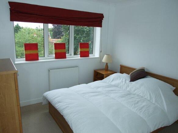 Master bedroom overlooking private communal garden
