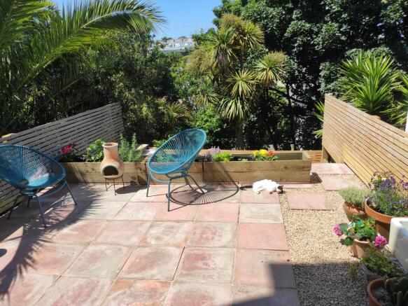 Patio garden leading to the grass garden below