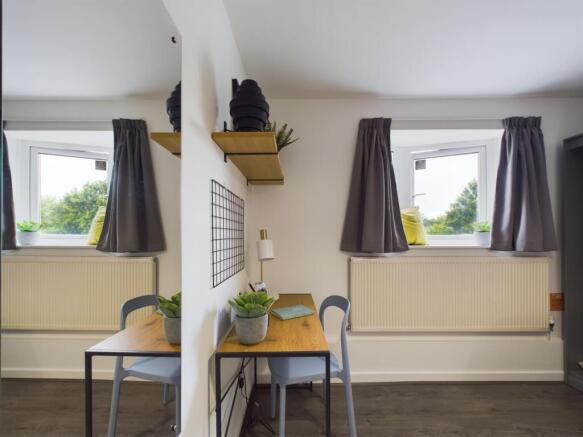 A bright and modern living room featuring two l...