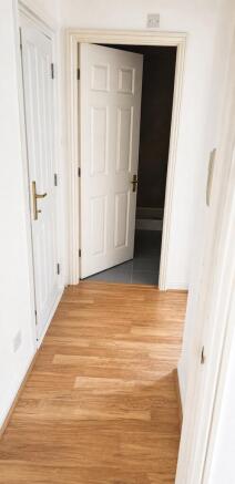 Bright hallway with stylish wood-effect floorin...