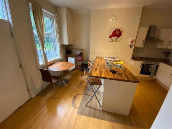 Bright and modern kitchen featuring a central w...