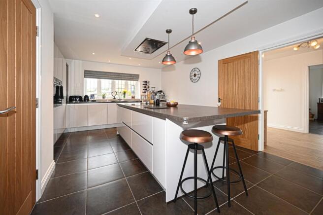 Living kitchen with bifolding doors into gardens