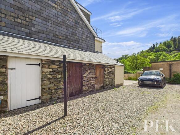 Side outhouse (white door) and Parking