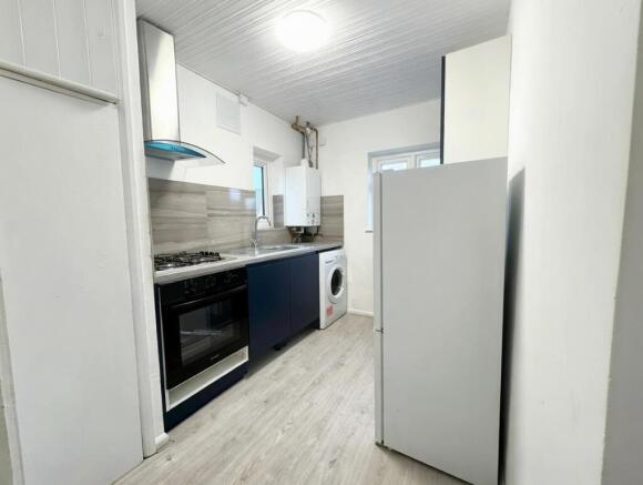 Contemporary fitted kitchen with modern applian...