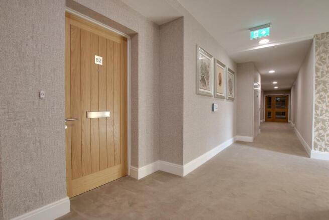 FRONT DOOR AND COMMUNAL HALLWAY