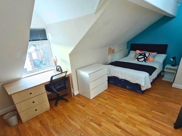 Bright attic double bedroom with a comfy double...