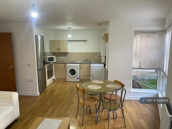 Well-Equipped Kitchen And Dining Area